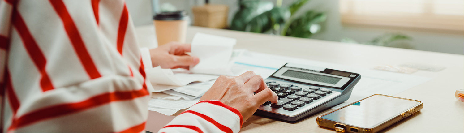 woman with calculator, energy efficiency loan